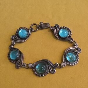 Vintage mid-century Mexican sterling silver featuring cabochon glass